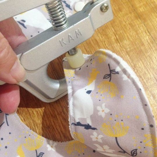 Attaching the snap fasteners to the bibs